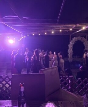 Guests gathered beneath the reception lights